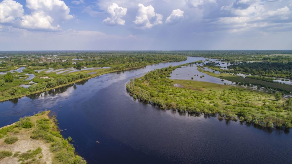 An aerial photo of the River Pripyat and its surrounding floodplain meadows, wetlands and oxbow lakes. This is an extremely important site for migrating birds (mainly waders) who stop here to feed on the abundance of food before continuing their migration. Turov area, Polesie, Belarus. © Daniel Rosengren